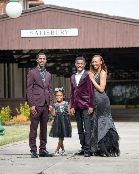 Stylish Black Family in Burgundy Suits and Black Dresses