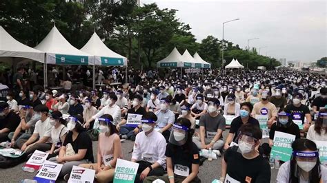 South Korea Trainee Doctors Sit In Outside Parliament To Demand