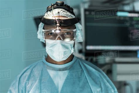 African american surgeon looking at camera in operating room - Stock ...