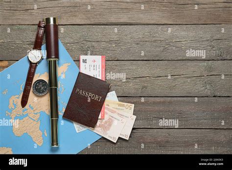 Guide S Belongings With World Map And Passport On Dark Wooden