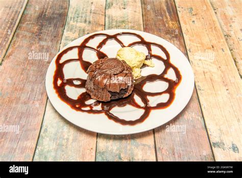 Chocolate Volcano Dessert With Vanilla Ice Cream On White Plate Viewed