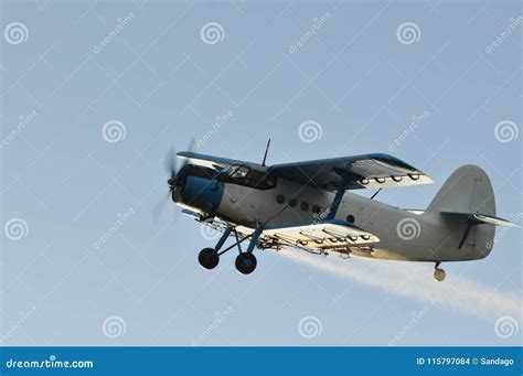 Old Plane Flying And Spraying The Crops Stock Photo Image Of Bomber