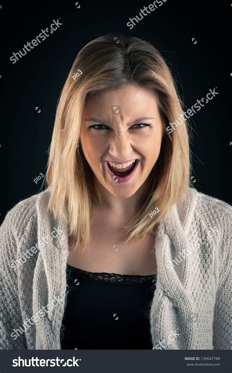 Angry Blonde Woman Close Up Portrait On Dark Background Stock Photo Shutterstock
