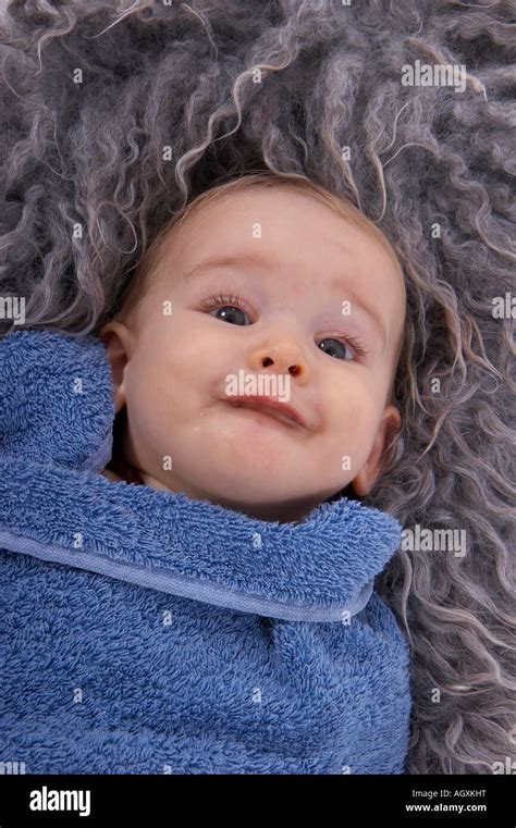 Baby With Grey Sheepskin Rug Stock Photo Alamy