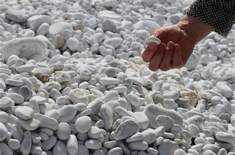 Premium Photo Cropped Hand Of Person Holding Stone