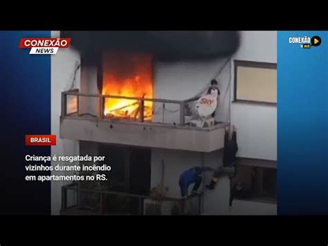 Vídeo Criança é resgatada por vizinhos durante incêndio em