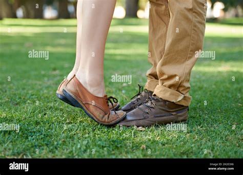 Closeup On Young Love Cropped Shot Of A Young Girl Standing Tiptoe On