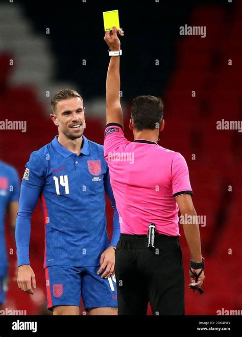 Referee Jesus Gil Manzano Shows Englands Jordan Henderson A Yellow