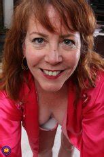 Mature Redhead Brie Bently Fingering Her Snatch Photos