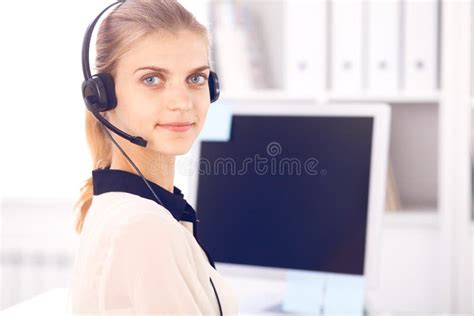 Call Center Operator Blonde Business Woman In A Headset In White