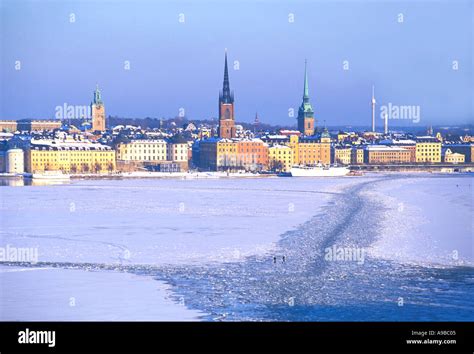 SWEDEN STOCKHOLM FROZEN LAKE MALAREN PEOPLE WALKING ON ICE Stock Photo