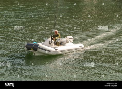 Inflatable dinghy outboard motor hi-res stock photography and images - Alamy