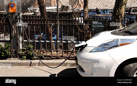 A Nissan Is Charging At A Charge Point Charge Station The Street On