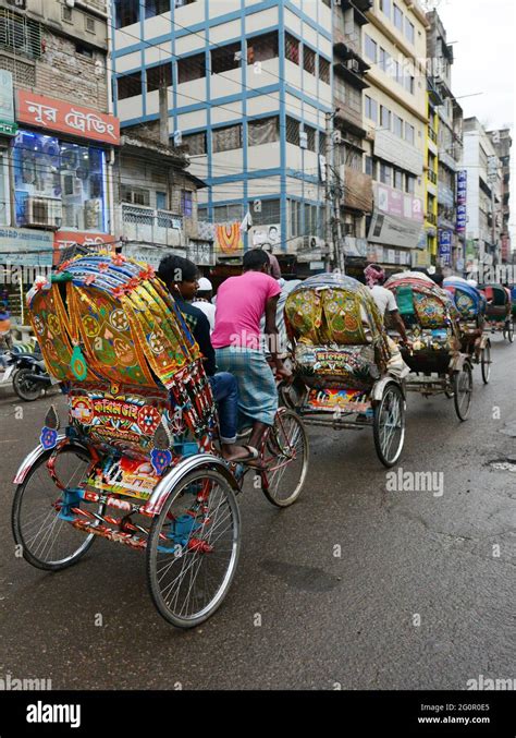 Colorful cycle rickshaws roaming the streets of Dhaka, Bangladesh Stock ...