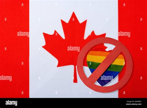 The Canadian flag and the LGBT ban. The red circle of the heart in the ...