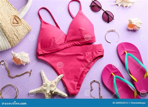 Beautiful Pink Bikini And Beach Accessories On Lilac Background Flat Lay Stock Image Image Of