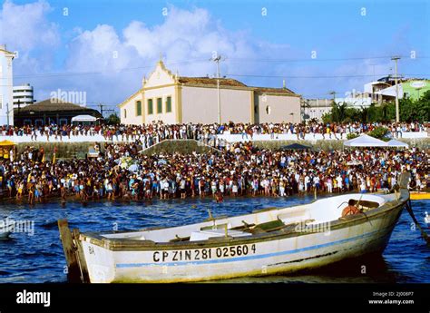 The Congregation On The Coast Waits For The Saveiros Traditional Sail