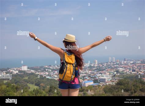 Brunette Stands With Arms Raised Stock Photo Alamy