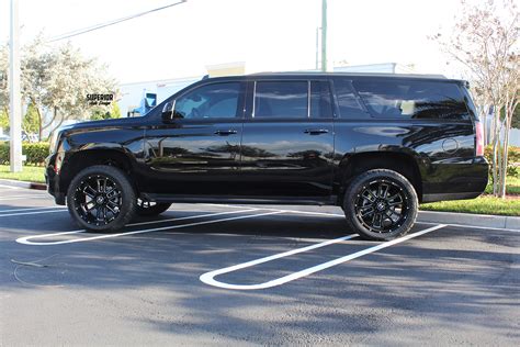 2016 GMC YUKON XL WITH 4 FTS LIFT KIT 22 HOSTILE WHEELS 33 NITTO