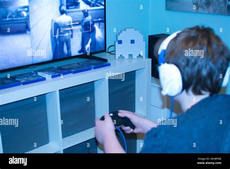 Teenage boy playing new Xbox console Stock Photo - Alamy