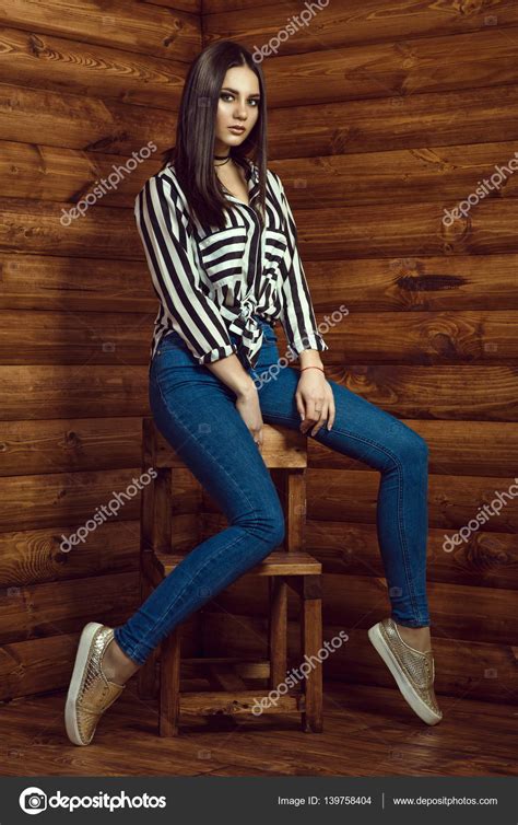 Portrait Of Young Beautiful Dark Haired Model Wearing Skinny High