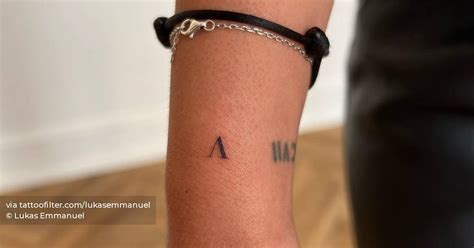 Letter V Tattoo Located On The Wrist Minimalistic