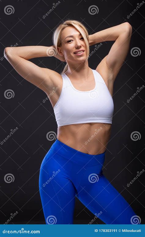 Beautiful Blonde Girl With Muscular Body Posing Fitness Concept Stock