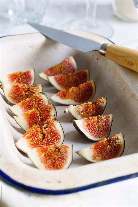 "A Tray Of Sliced Ripe Figs, Ready To Garnish A Dessert." by Stocksy ...