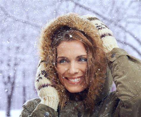 Loving The First Snowfall An Attractive Woman Enjoying Herself Outside