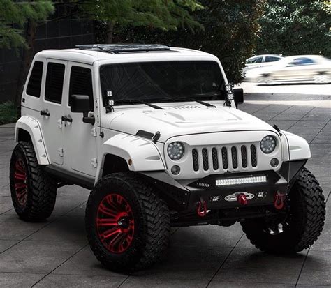 A White Jeep Jk With Red Rich Deep Color Wheels Red Jeep Wrangler