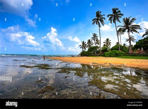 Hikkaduwa Beach and his coral reef on a sunny day, Sri Lanka Stock ...