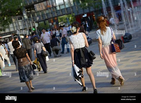 women walk sanlitun shopping mall beijing china Stock Photo - Alamy