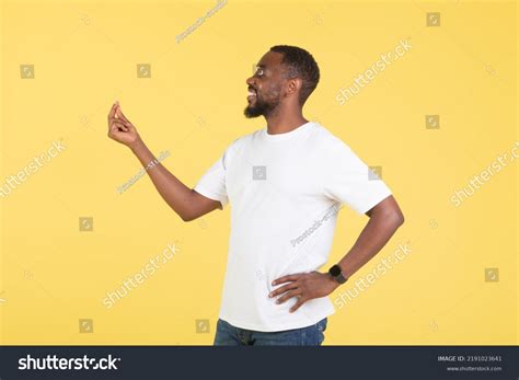 Cheerful African Man Snapping Fingers Over 8 Royalty Free Licensable