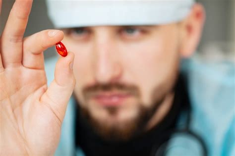 Premium Photo Close Up Of Male Doctor Holding Pill For Men Health