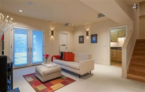 A Living Room Filled With Furniture Next To A Stair Case