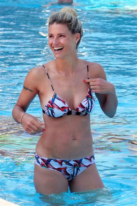 Michelle Hunziker Sports A Colorful Bikini While Relaxing By The Pool