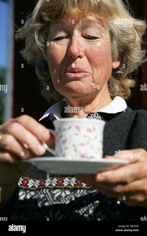 A Senior Woman Drinking Coffee Stock Photo Alamy