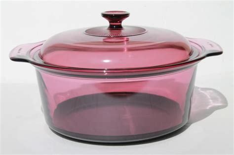 A Pink Casserole Dish With A Glass Lid