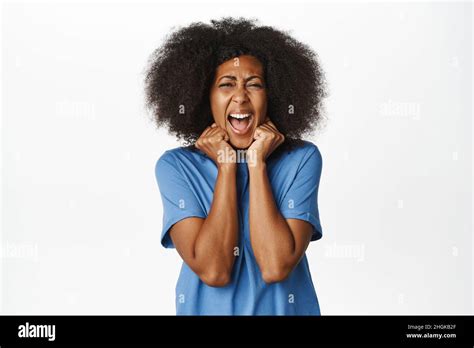 Portrait Of Scared African American Woman Screaming Looking Terrified