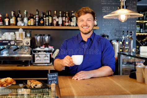 Handsome Barista Tasting A New Type Of Coffee In His Coffee Shop Stock