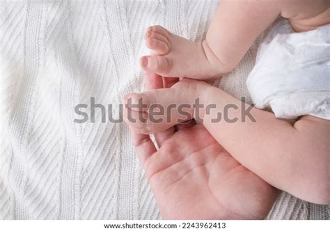 Female Hands Hold Babys Legs On Stock Photo Shutterstock