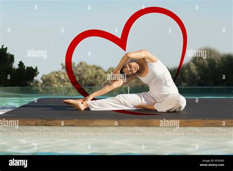 Composite Image Of Peaceful Brunette In Janu Sirsasana Yoga Pose