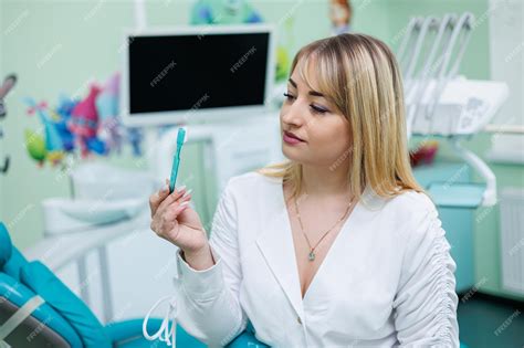 Premium Photo The Dentist Is In His Dental Office Dentist Woman In A