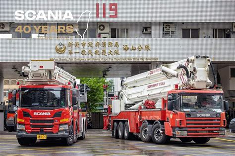 Two Red And White Fire Trucks