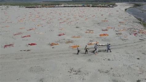 COVID-19: Mass graves on the banks of the River Ganges in India | World News | Sky News