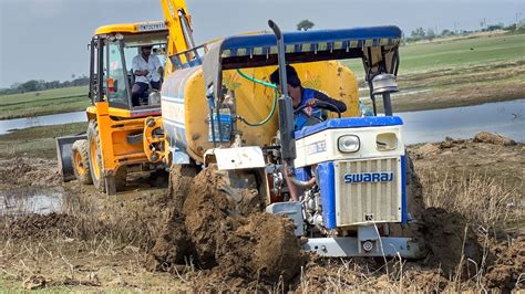 Jcb Dx Pulling Out Swaraj Fe Tanker Tractor Stuck In Pond Mud Jcb