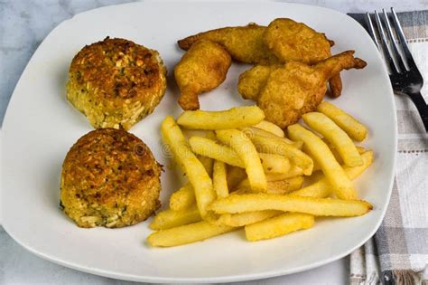 Two Crab Cakes With Fries And Beer Batter Shrimp Stock Photo Image Of