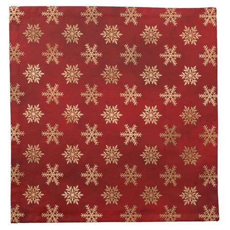 A Red Rug With Gold Snowflakes On It