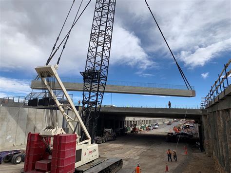 Installing bridge beams (girders) for the southern portion of the cover