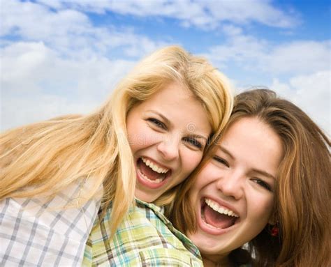 Two Happy Woman Friends Laughing Stock Image Image Of Green